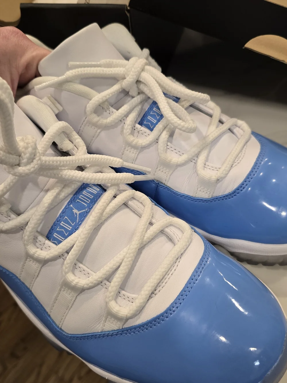 Air Jordan 11 Low Retro White and University Blue Sneakers